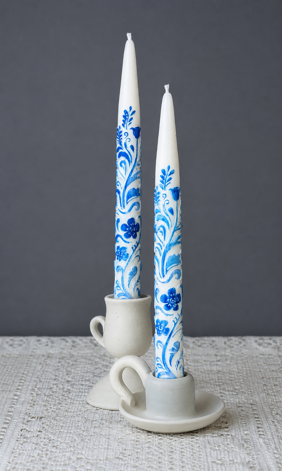 Pair of blue and white hand-painted taper candles in ceramic holders