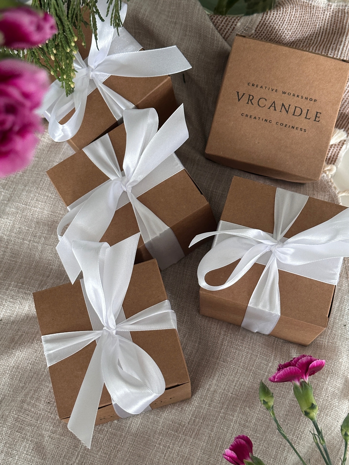Wrapping handmade gift-ready candles in the VRcandle studio
